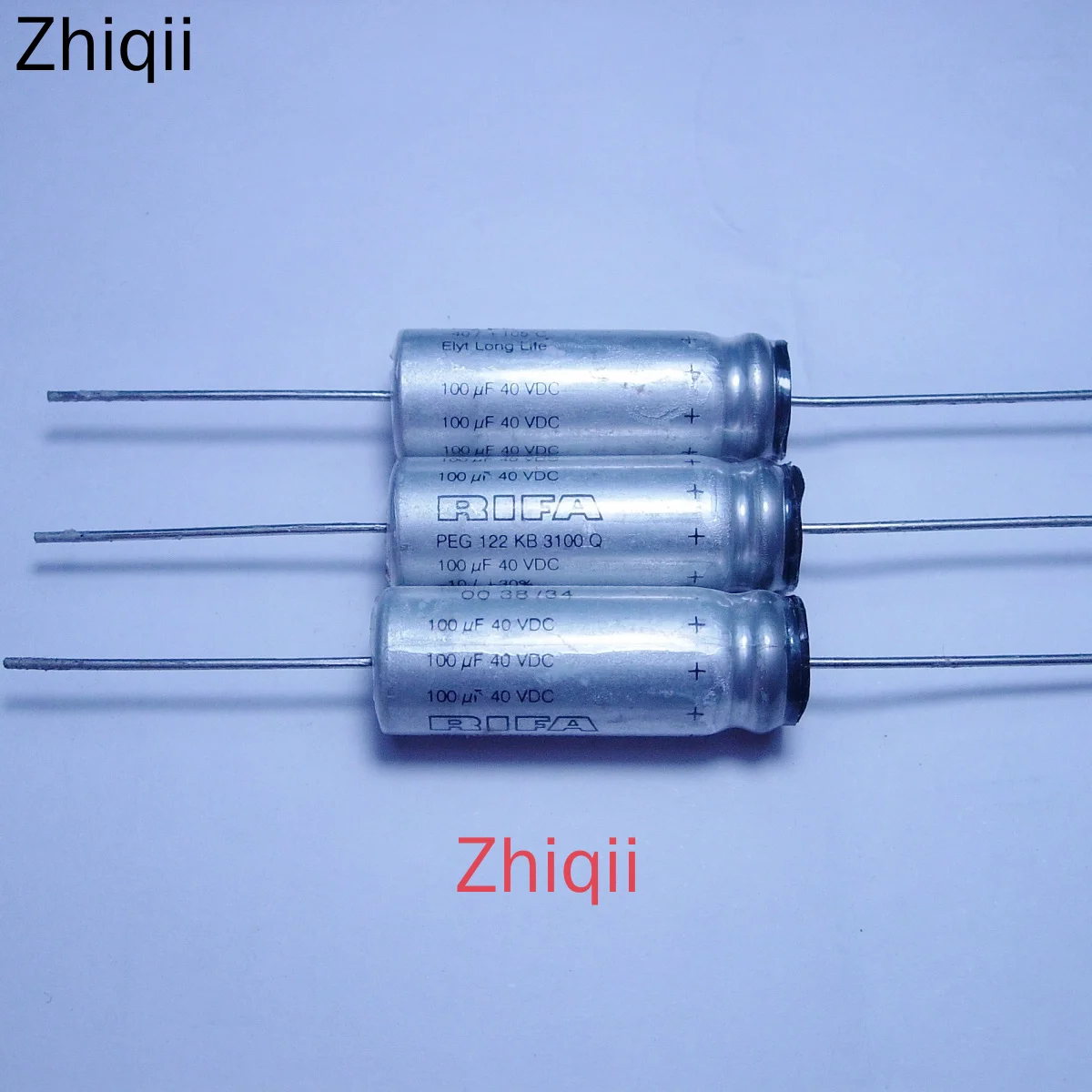 4 قطعة/الوحدة الرفاعي PEG122 سلسلة 100 فائق التوهج 40V 10*28 مللي متر الأصلي جديد 40V100UF محوري حمى مكثف 100uF40VDC 100 فائق التوهج/40V النحاس قدم #1