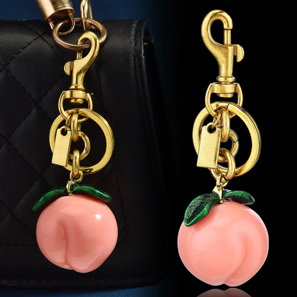 

01Лучшие продажи сумок-брелок с фруктами, модные персиковые подвески, брелоки и персонализированные аксессуары.