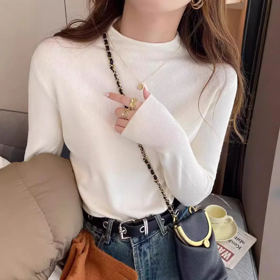 Nueva moda mujer Color sólido Simple básico suelto Casual moda medio cuello alto manga larga suéteres de punto camiseta interior femenina