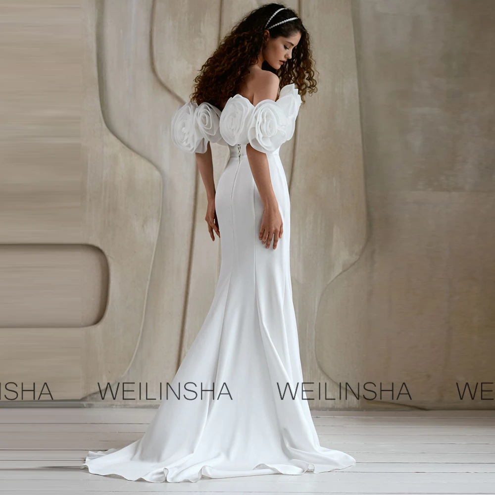 เทรนด์ชุดเดรสผู้หญิงสุดหรู ปี 2025 ชุดเดรสทรงเมอร์เมดผ้าเจอร์ซีย์สำหรับงานแต่งงาน งานเลี้ยง สีขาว เปิดไหล่ ประดับดอกไม้ 3 มิติ ชุดเดรสสำหรับงานแต่งงานในห้องโถง