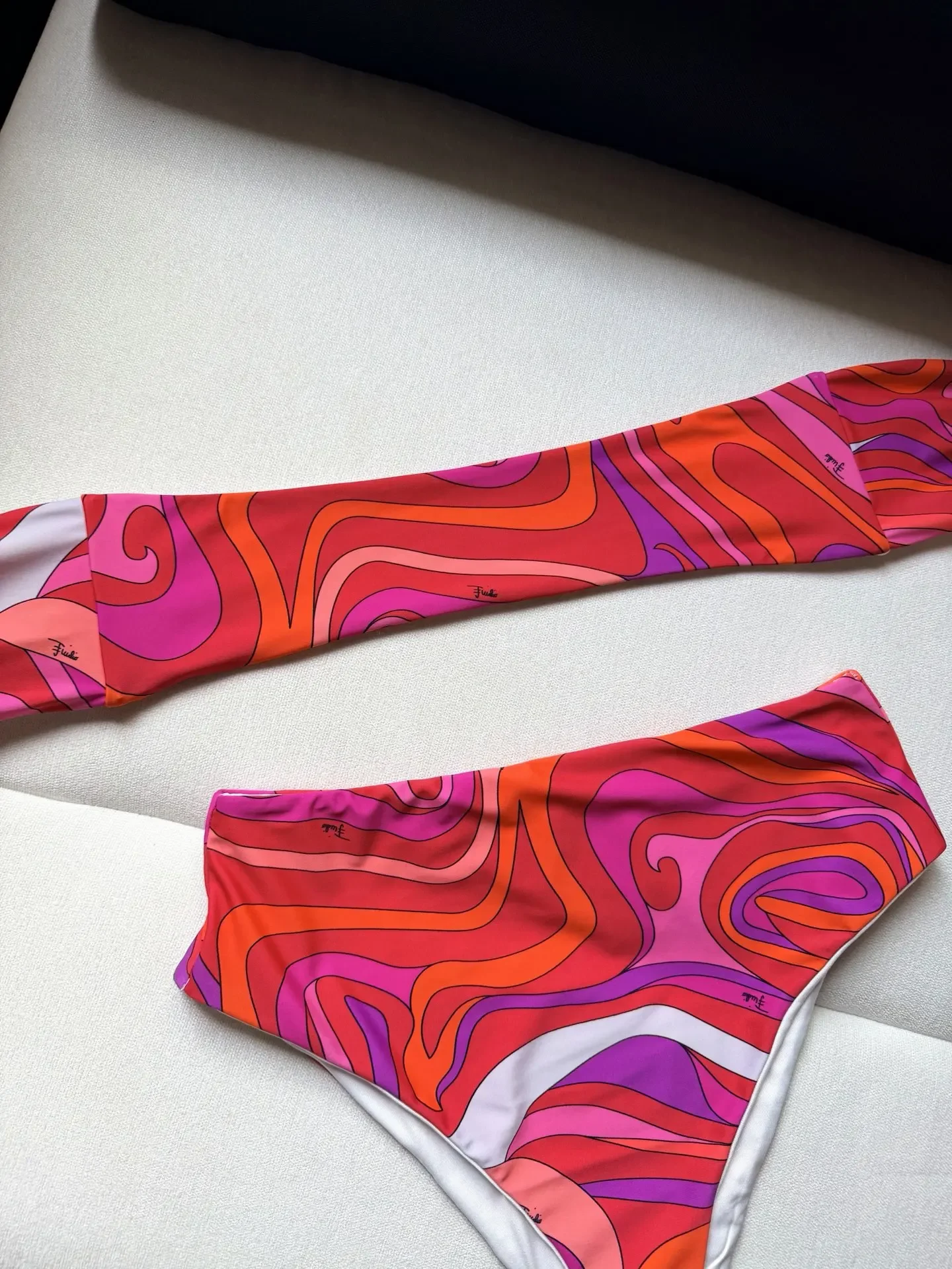 

New The new bikini swimsuit is adorned with the iconic whirlpool print throughout the body