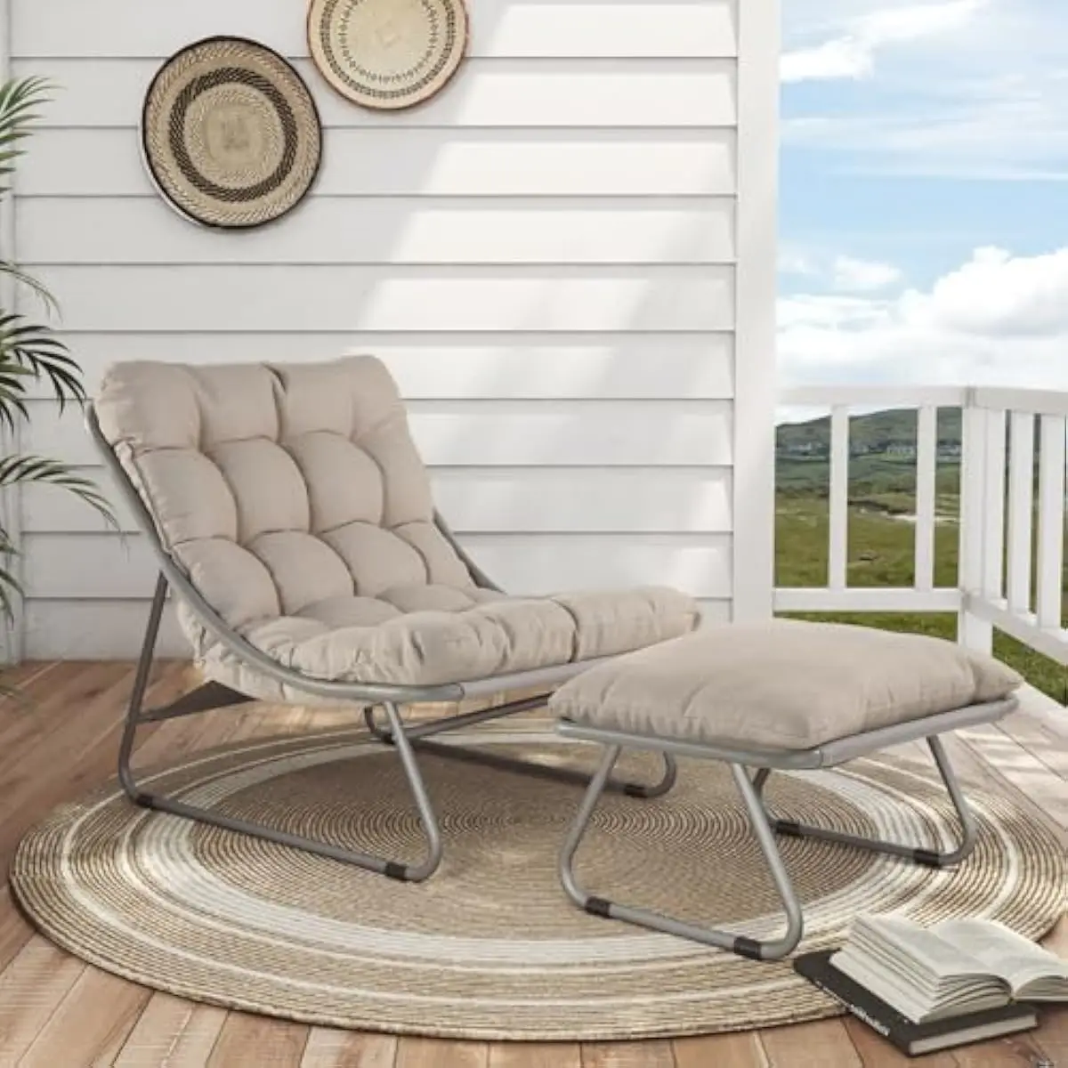 Outdoor reclining chair with integrated footrest and plush weatherproof cushion — sleek steel frame finished in electrocoated ch