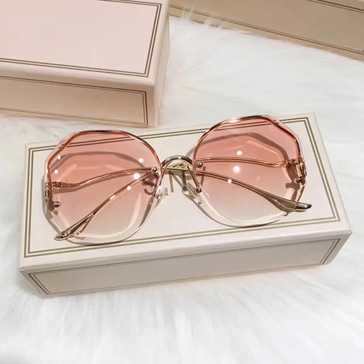 

2024 Borderless Trimmed Fashionable Sunglasses for Women UV400 Protection Sunglasses New Trend Ladies Metal Curved Legs Eyewear