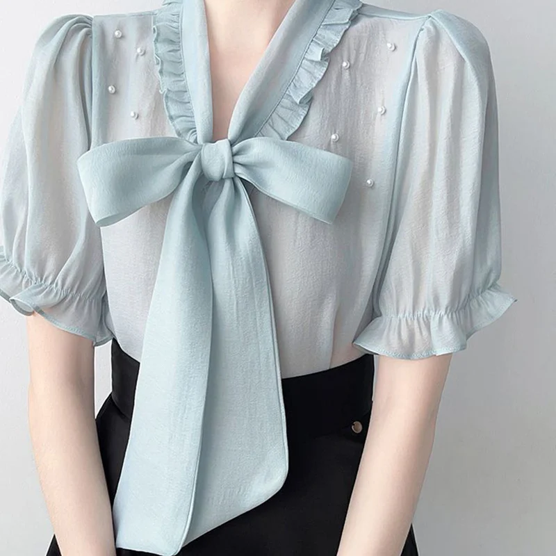 Verano moda coreana arco cordones bordado bengalas camisas 2025 nueva manga corta con cuello en V todo-fósforo volantes blusa mujeres Tops