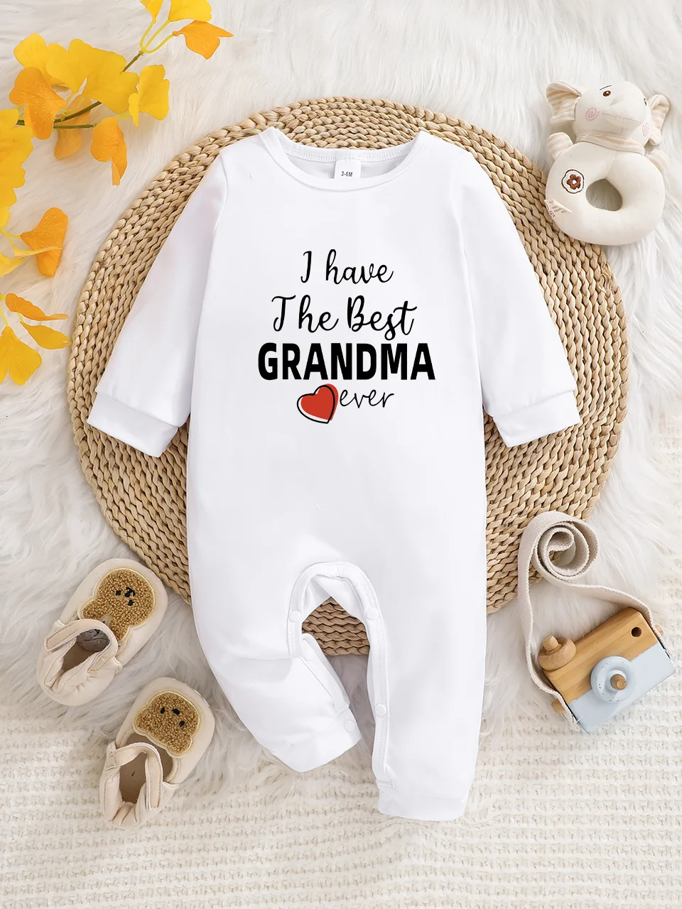 A baby long-sleeved onesie with interesting letter prints. It features a buttoned design for easy putting on and taking off