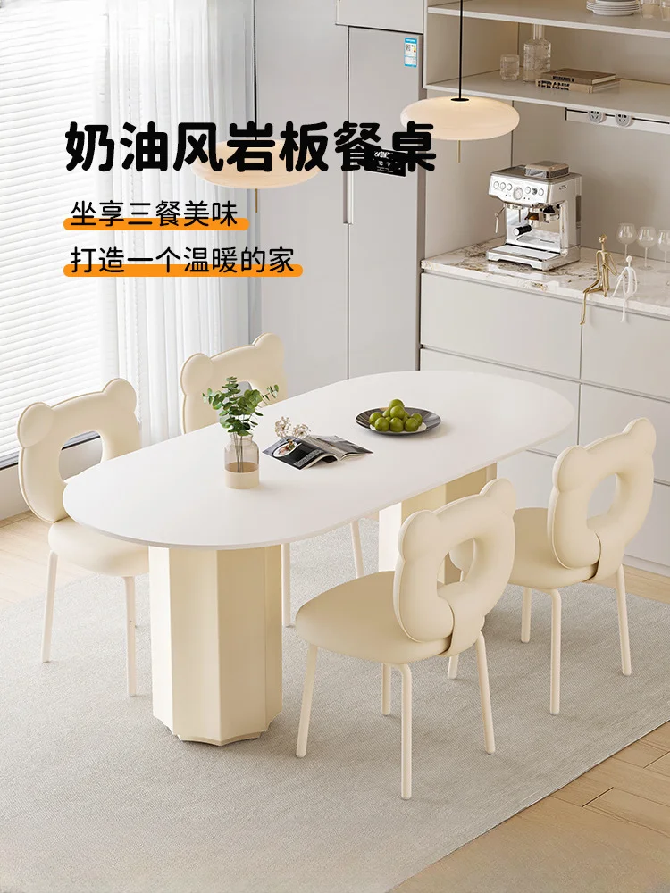 Cream style dining table light luxury modern simple island platform rock slab dining table and chairs 2024 new oval family