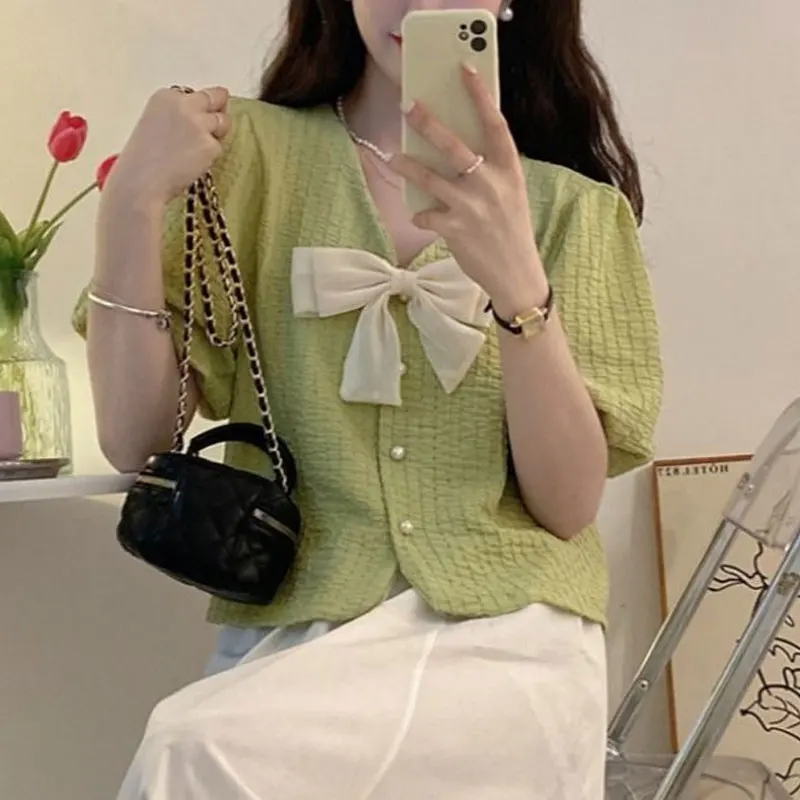 Korean Sweet V-Neck Bow Shirt Women\'s Clothing Elegant Single-breasted Summer Solid Color Casual Basic Short Sleeve Loose Blouse