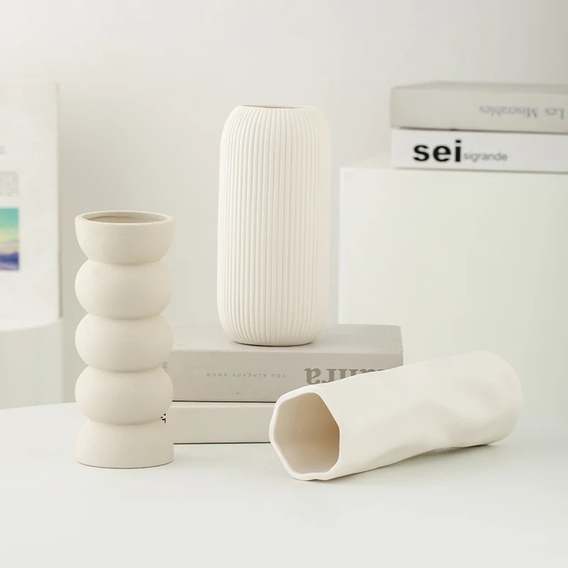 

Simple and trendy ceramic vase for ins style. White piece for home flower arrangement. Luxurious and high-end look for dining ta
