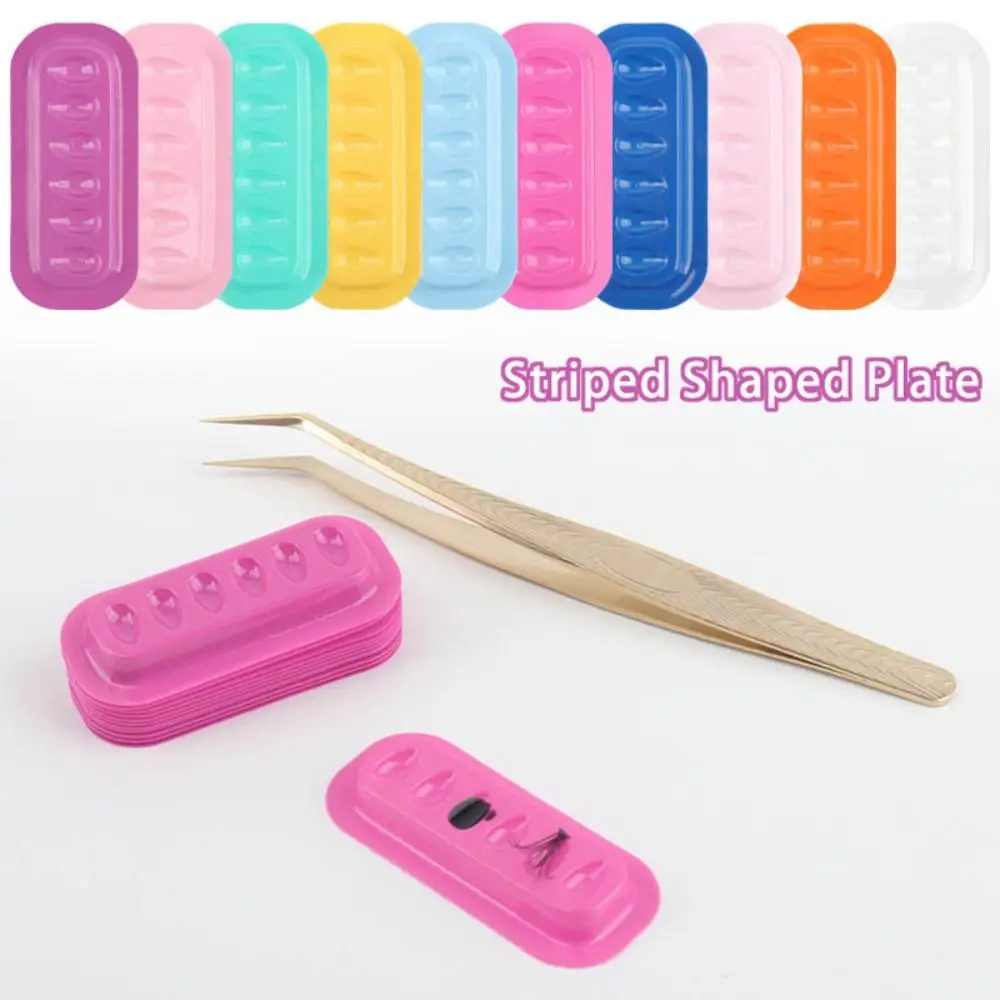 

100PCS Colorful Adhesive Eyelash Glue Holder Strip Shaped PVC Lash Adhesive Stand Pads Flower Eyelash Glue Pallet