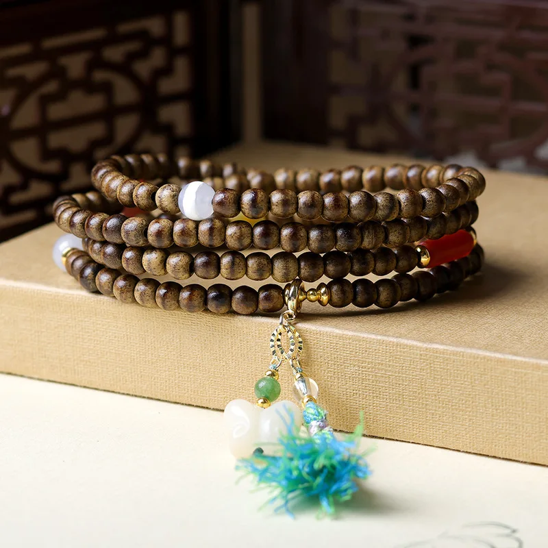 First-line yellow butterwood agarwood multi-strand bracelet featuring amber, agate and bodhi root beads with a butterfly desi