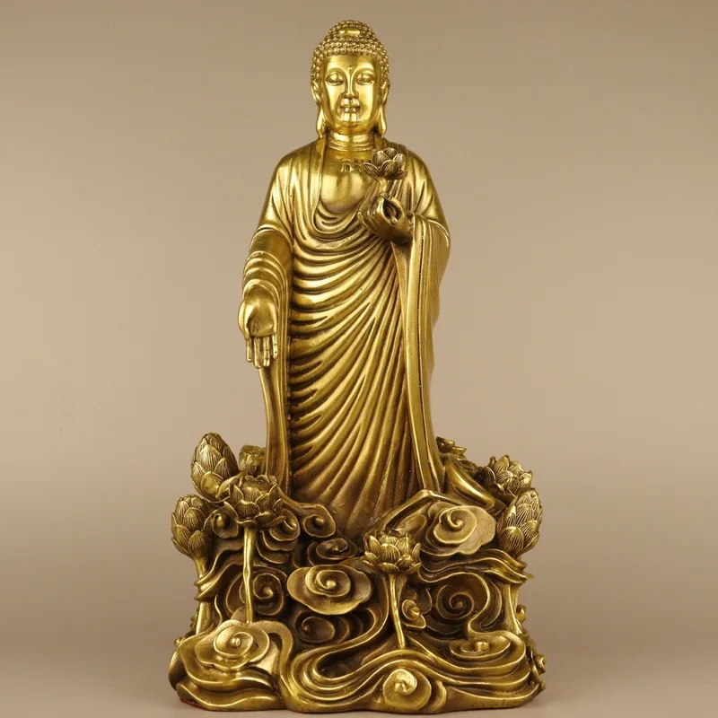 , standing on a , a bronze art piece, a lotus flower Shakyamuni Buddha