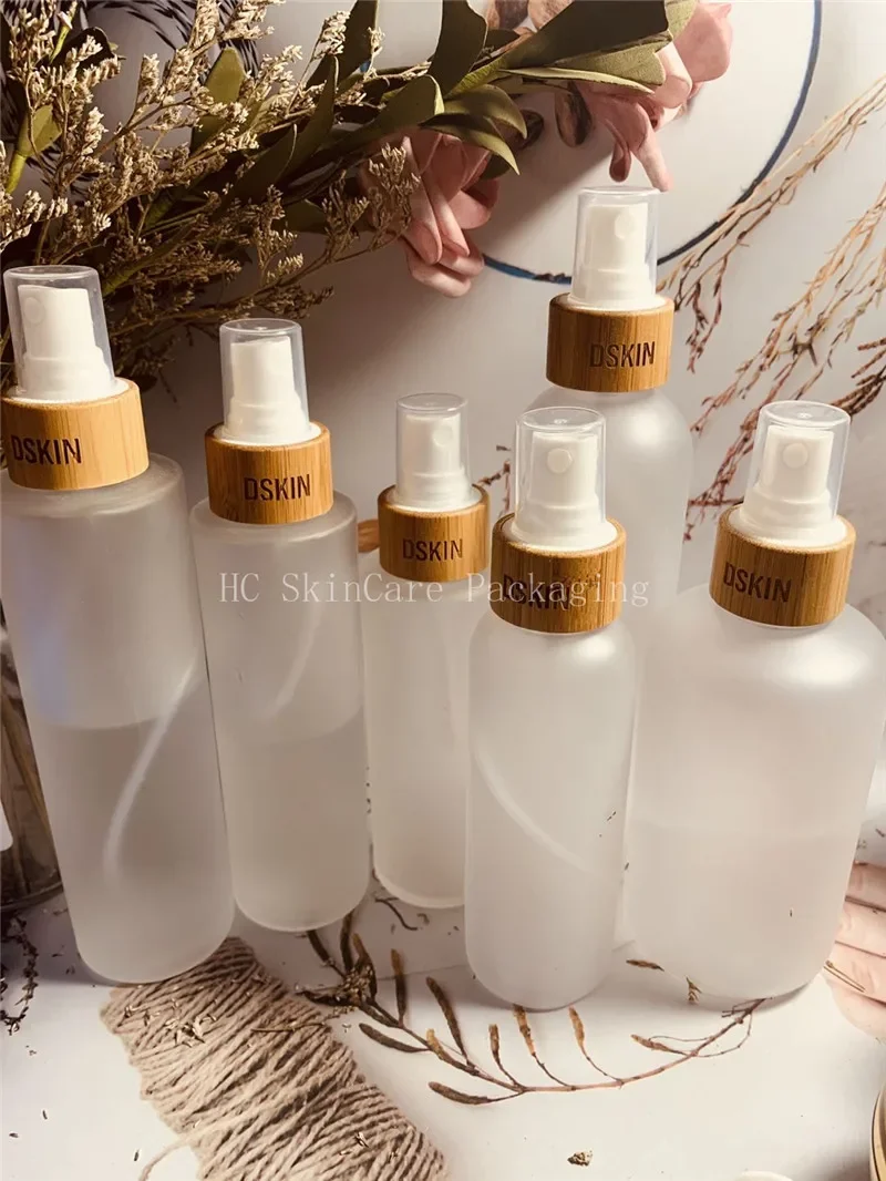 

Hot Sale Spray Bottles Transparent Frosted Glass Bottle Environmental Bamboo Lid Lotion Pump Fine Mist Empty Cosmeticcontainers