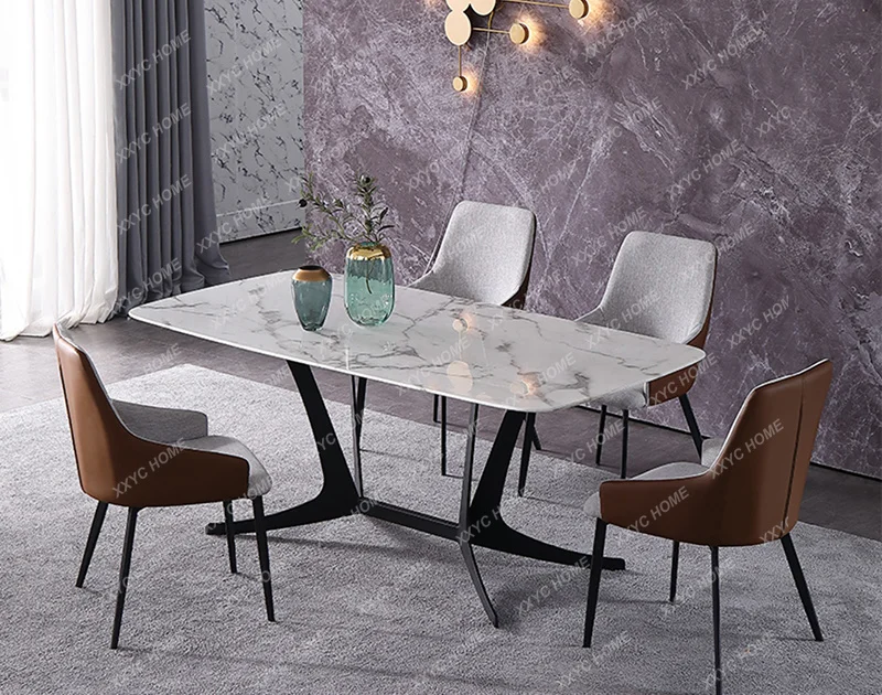 A modern simple high-end imported rectangular rock slab dining table light luxury size apartment universal