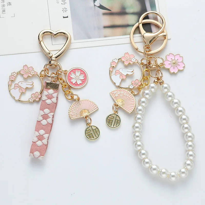 Korean Sweet Cherry Blossom Rabbit Keychain for Women Creative Webbing Pearl Key Chain Handbag Headphone Case Pendant Jewelry