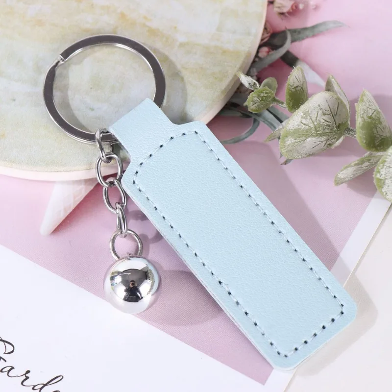 โลโก้ที่กําหนดเองพวงกุญแจเปล่า PU หนังเลเซอร์แกะสลักพวงกุญแจรถอุปกรณ์เสริมหลายสีส่วนบุคคล Key Chains