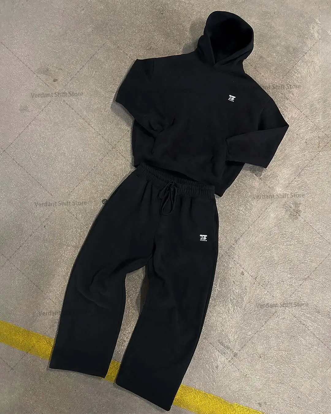 

Black hoodie and wide-leg sweatpants set Street-style minimalist fashion trend sportswear set Neutral-style streetwear fashion