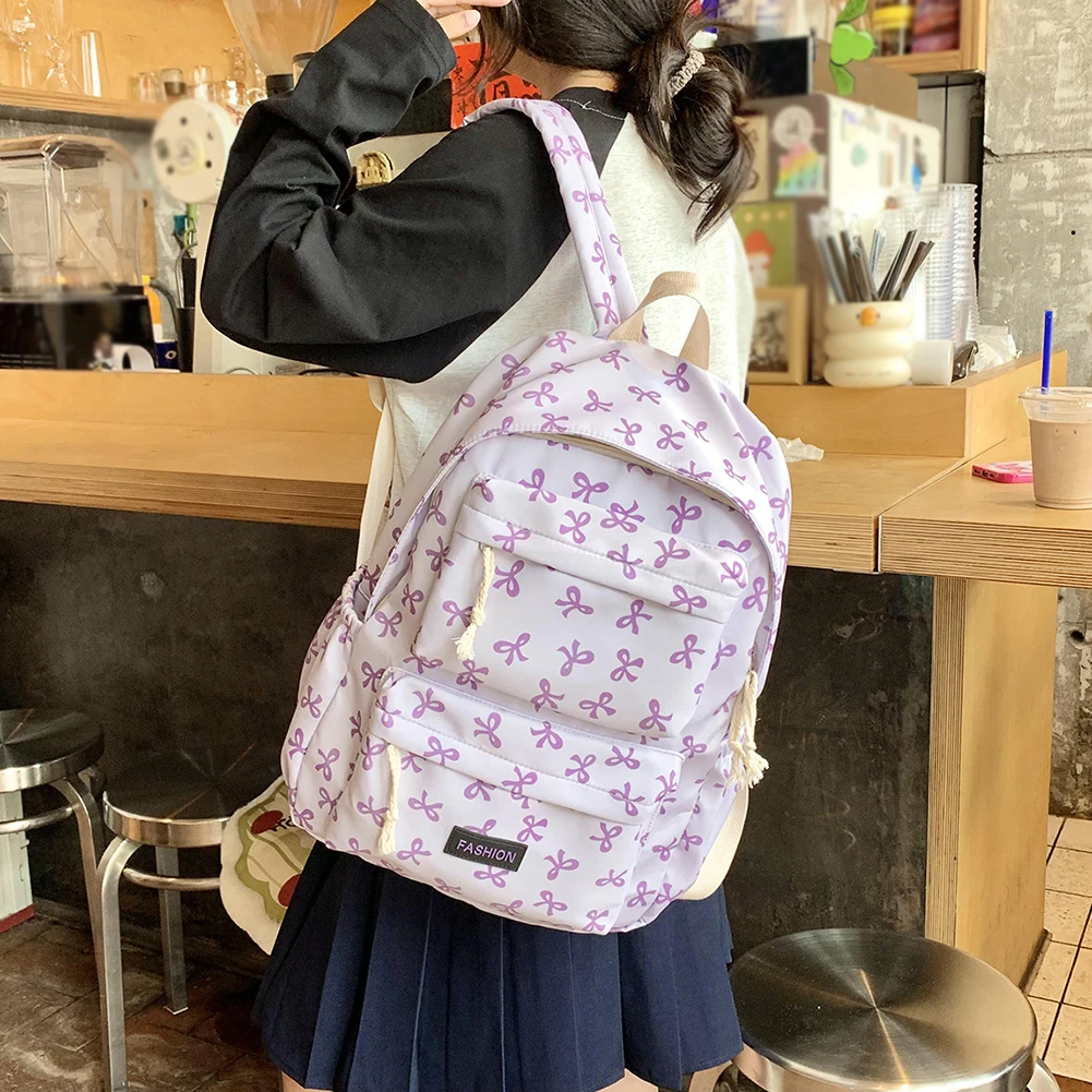 حقيبة ظهر مدرسية مطبوعة على شكل فيونكة حقيبة ظهر جامعية Preppy حقيبة مدرسية متوسطة للفتيات المراهقات