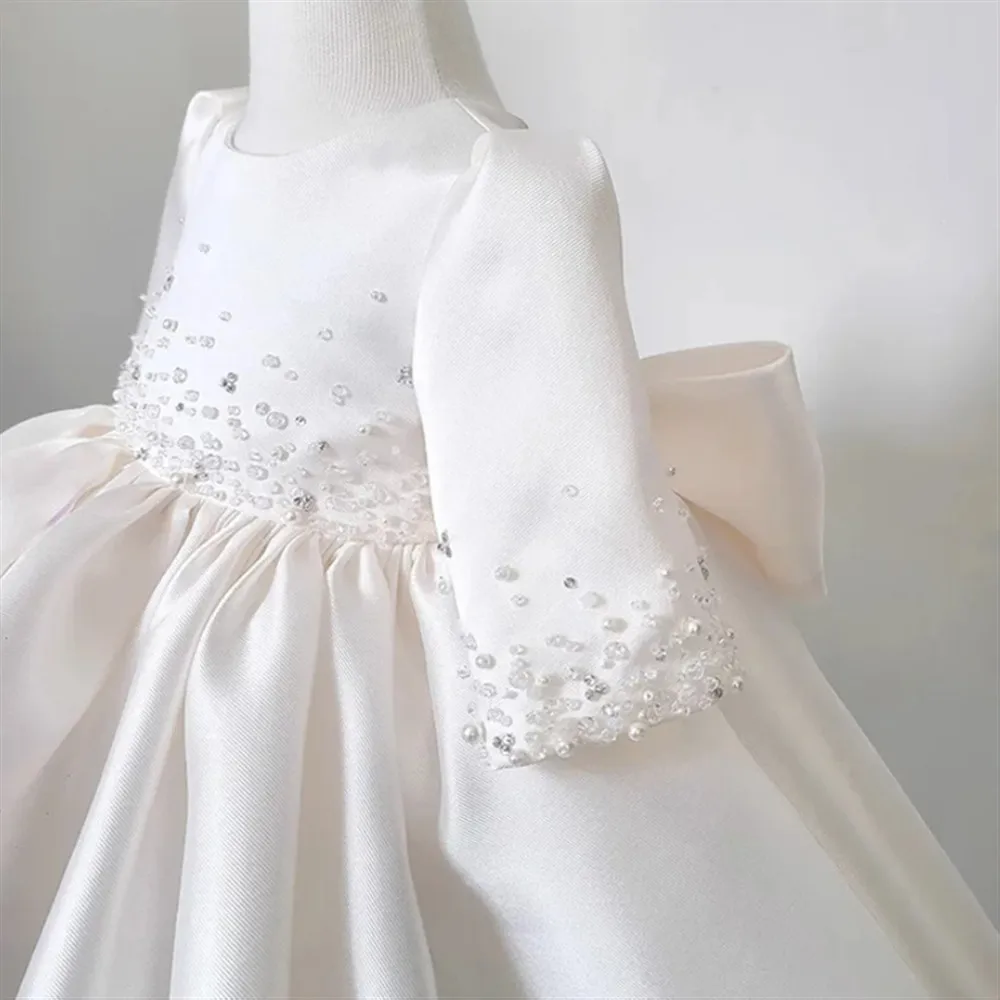 Robe de mariée en Satin blanc pour filles, personnalisée, élégante, à fleurs, perlée, avec nœud, robe de princesse pour fête d'anniversaire, robe de bal de baptême pour bébé