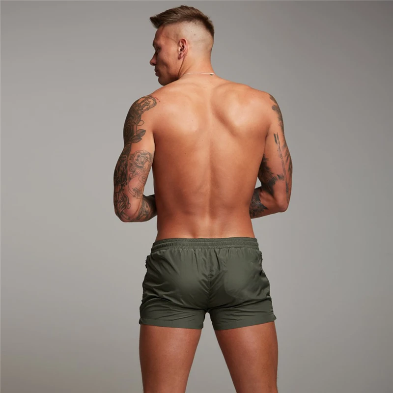 Summer Quick Dry Board Bodybuilding Shorts Men Casual Active Sexy Beach Surf Swimi Shorts Gym Fitness Shorts with Zipper Pocket