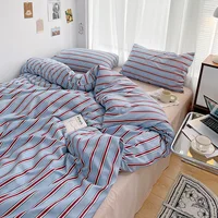 Simple Red and Blue Striped Duvet Cover and Four Piece Bed Sheet Set with Washed Cotton Bedding on the Bed 3