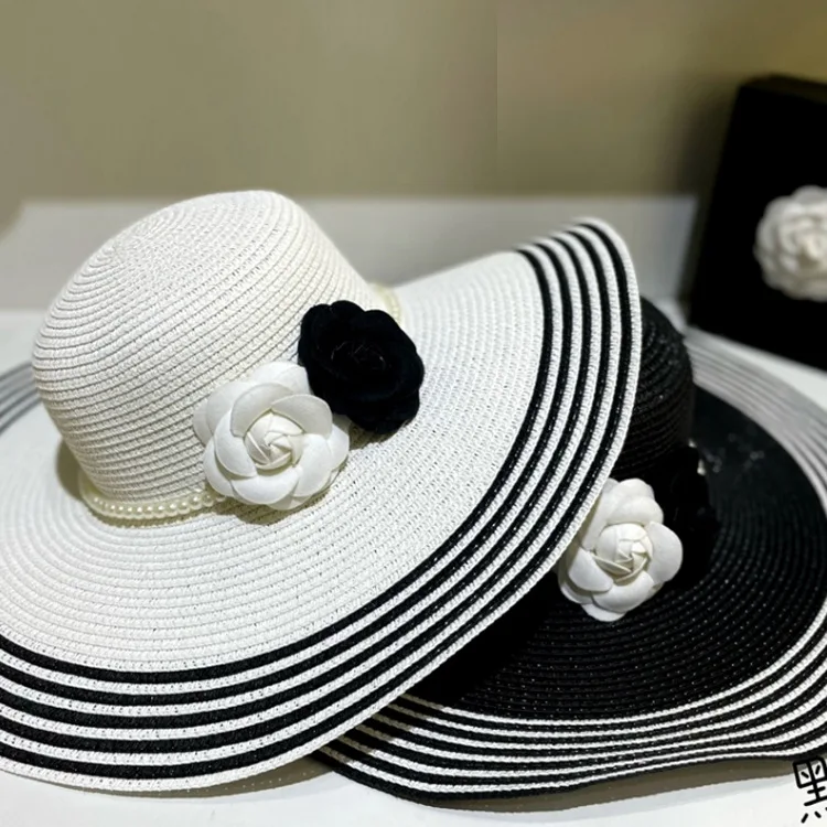 Elegant retro small fragrance black and white stripes oversized eaves straw hat female fashion catwalk shoot sunscreen visor hat