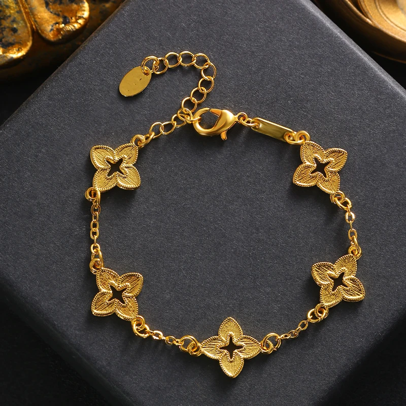 A simple and fashionable hand chain in the shape of a golden four-leaf clover, trending in the European-American style.