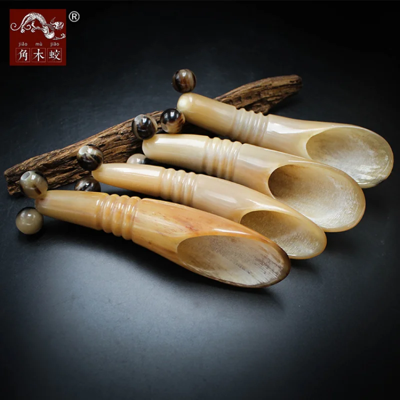 

Made from hornwood yak horn, the gua sha roller and two-wheel massage cart