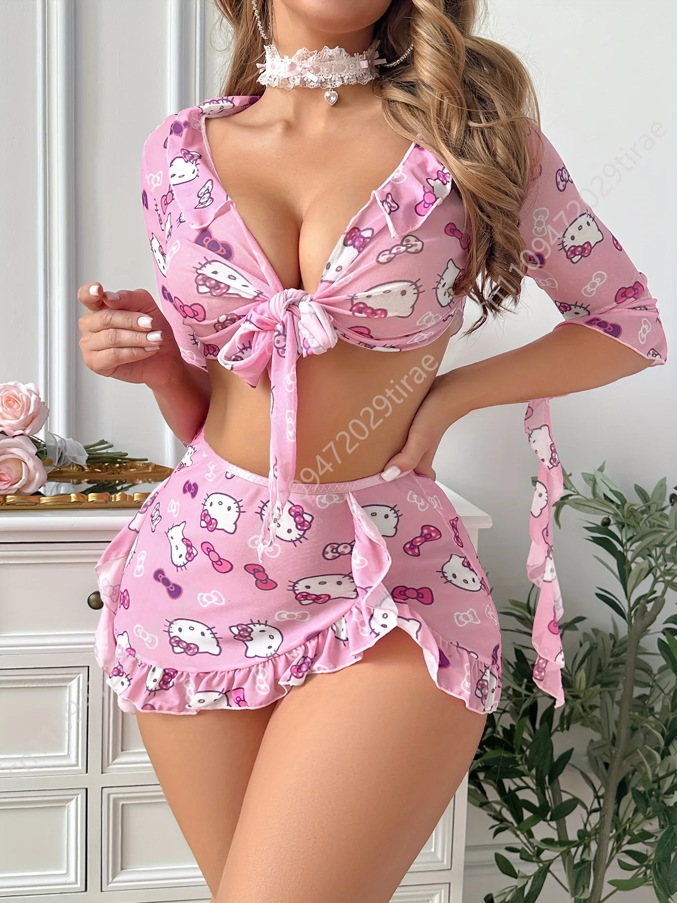 

Charming Hello Kitty-Themed Lingerie Ensemble, Featuring a Pink Crop Top with a Tie Front, Ruffled Edges, And Half Sleeves, Acco