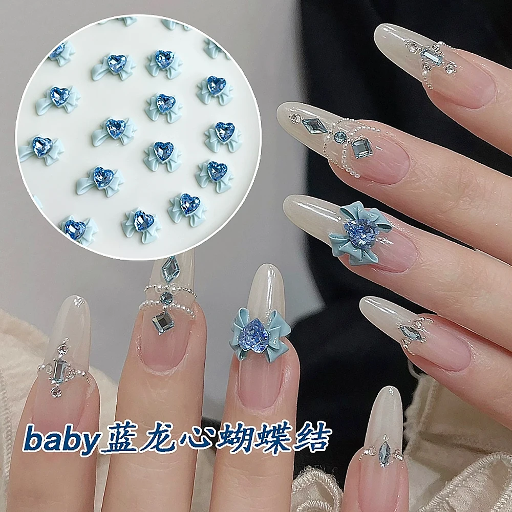 50pcs 드래곤 하트 다이아몬드 보우 네일 액세서리 3D 블루/핑크 연인 Bownot 네일 매력 여자를위한 우아한 네일 쥬얼리 장식
