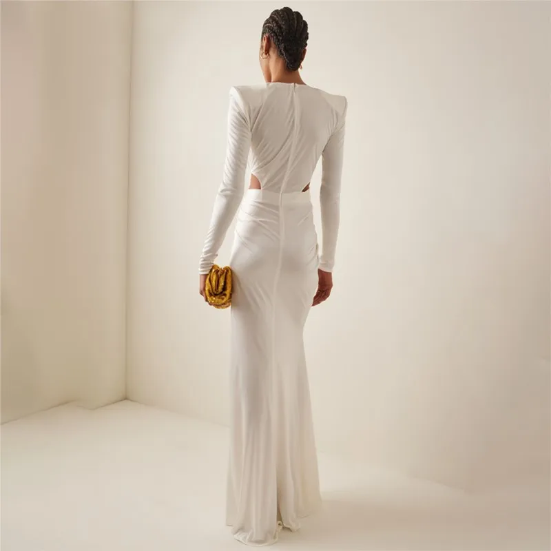 A long white long-sleeved pleated cut-out and crossed stretch dress