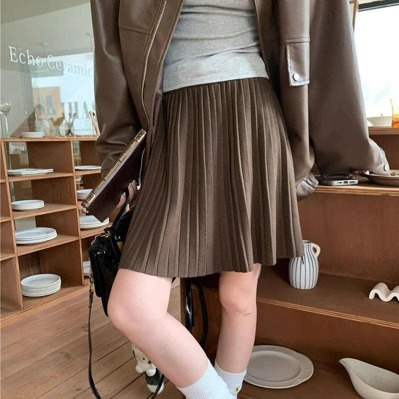 Rimocy Preppy สไตล์ถักกระโปรงมินิกระโปรงผู้หญิง 2025 ฤดูใบไม้ผลิเอวสูงจีบกระโปรงสั้นผู้หญิงกระโปรงสายกับเข็มขัด