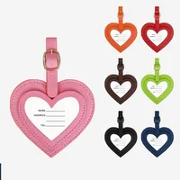 Etiqueta de equipaje Simple de cuero Pu para mujeres y hombres, etiquetas de tarjeta colgantes antipérdida coloridas en forma de corazón de PU