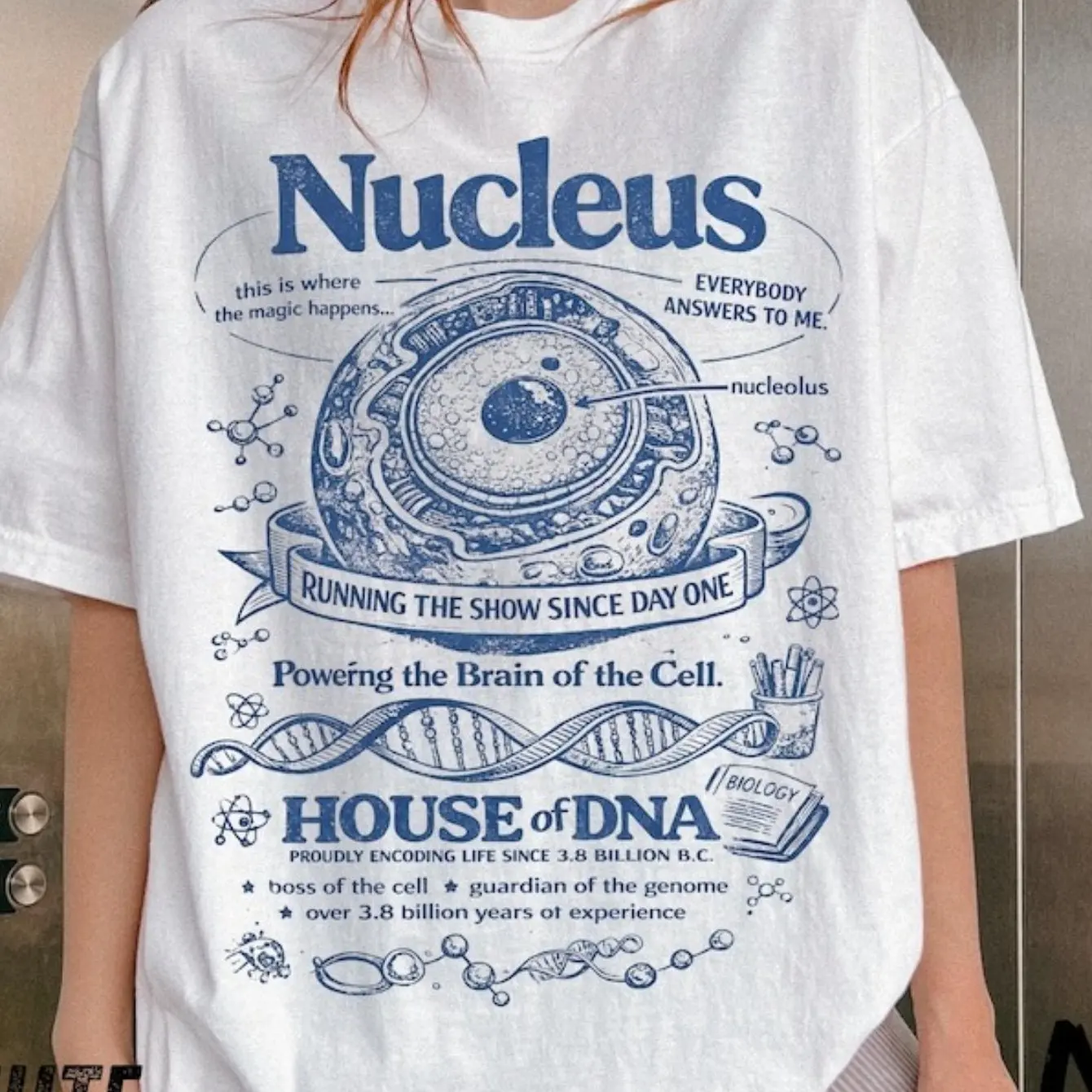 Retro science-themed T-shirt with cell nucleus blueprint, fun short-sleeved shirt with 90s retro molecular biology atlas print.