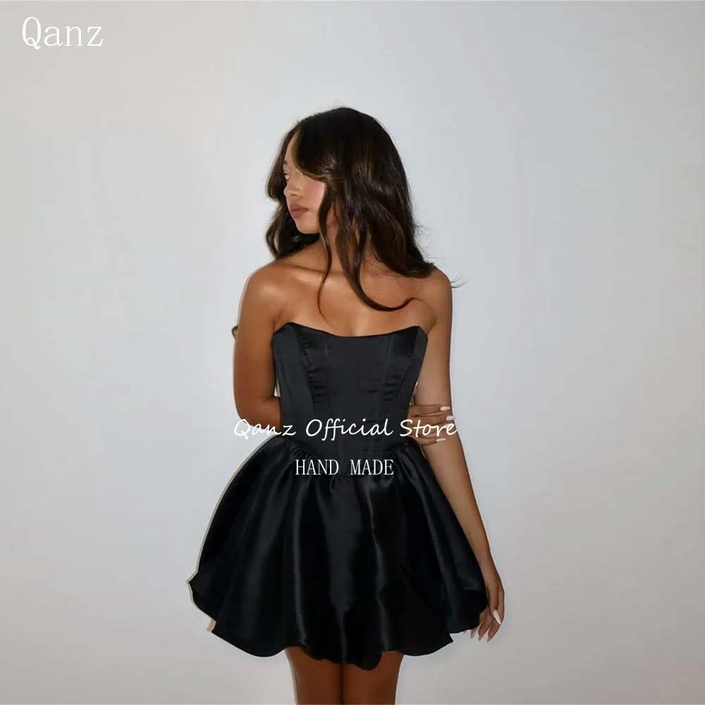 Qanz فساتين لحضور الحفلات الموسيقية الصغيرة من الساتان الأسود قصيرة على شكل حرف A منتفخة فستان التخرج 2025 مثير بدون ظهر للنساء فيستدوس دي فيستا مخصص