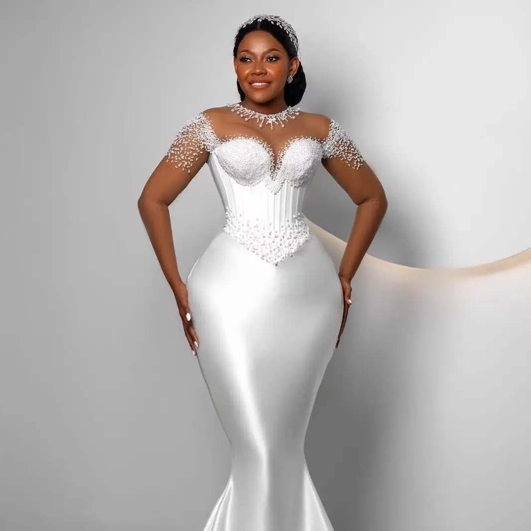 カスタムメイドの豪華なパールビーズをあしらったマーメイドスタイルのアフリカのウェディングドレス、シアーなOネック、ロングスリーブのガウン、vestido de novia（スペイン語でウェディングドレスの意味）