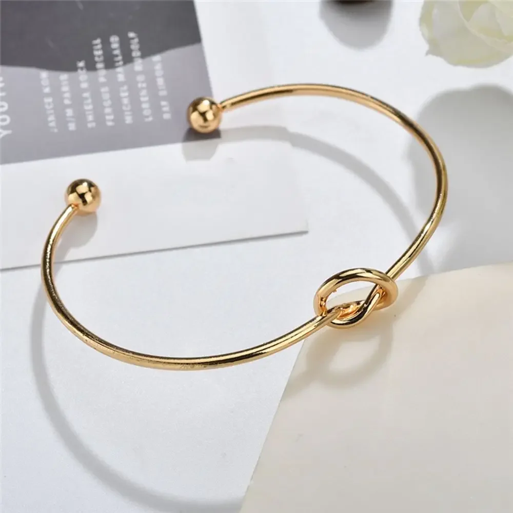 

Personality Fashion Stainless Steel Heart Tie A Knot Bangle for Women Charm Cuff Bracelet Jewelry Gift