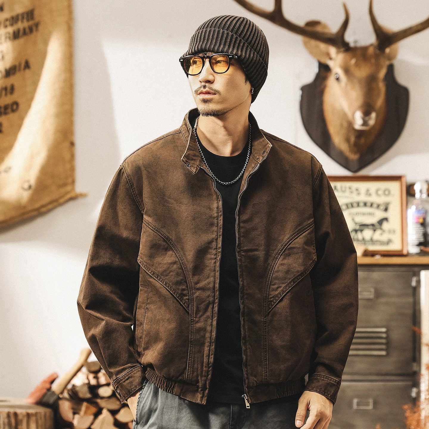 

A trendy man's new retro workwear jacket for autumn and winter, an aged loose jacket