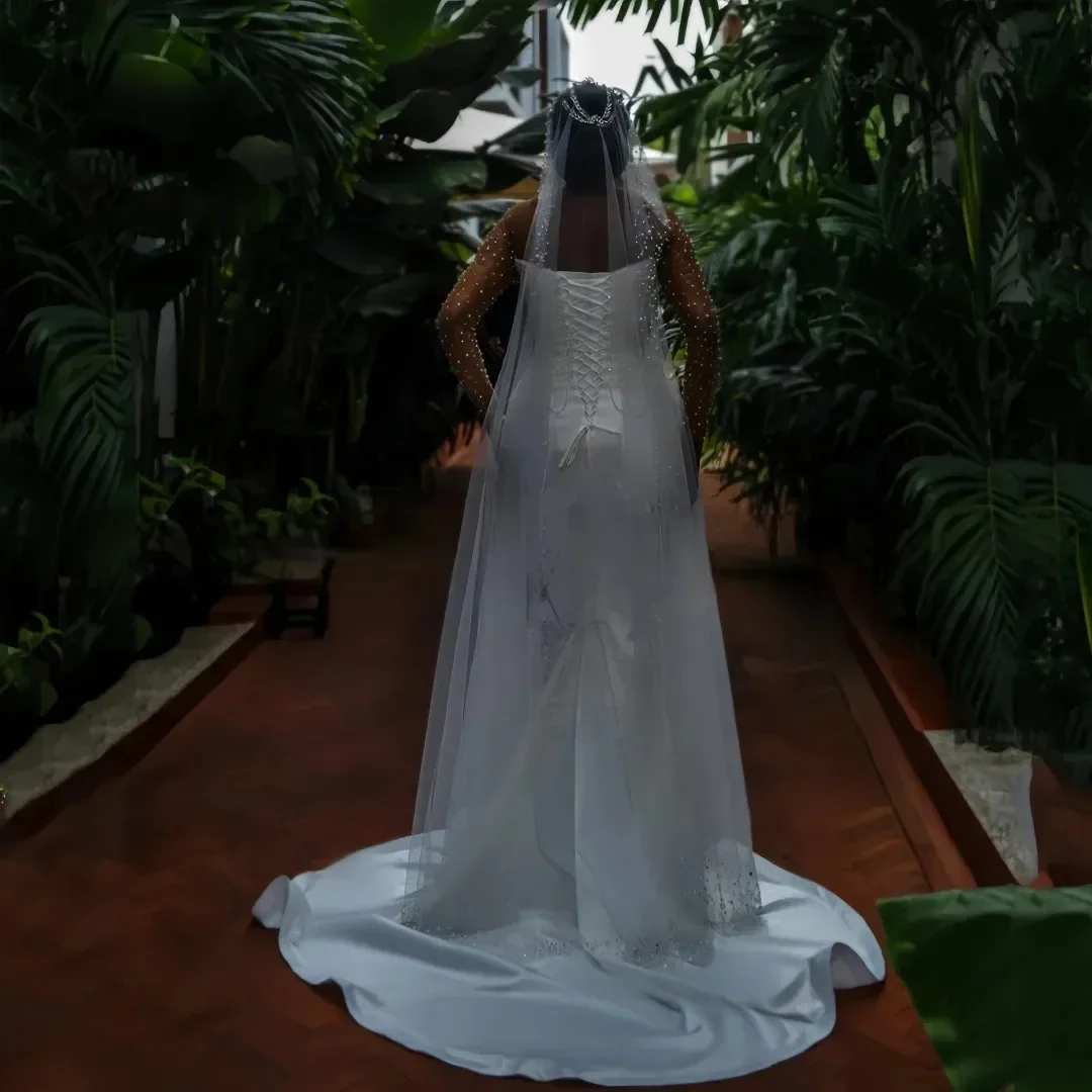 Maßgeschneidertes schiere Hals funkelnde Perlen Perlen Meerjungfrau Garten Hochzeitskleid Vestidos Noivas Illusion lange Ärmel Brautkleid