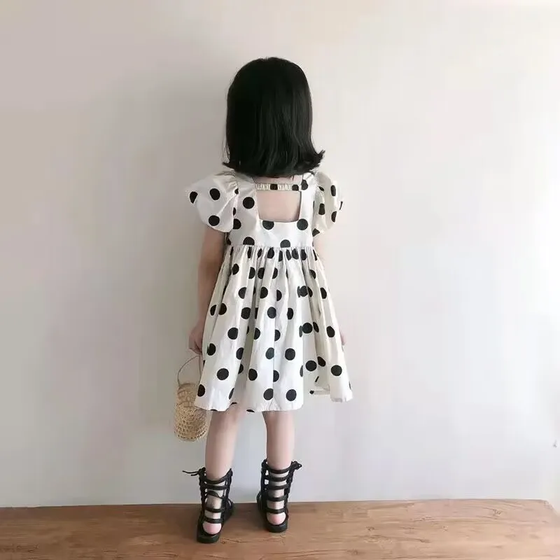 Mädchen Sommer Kurzarm Kleid neue Tupfen koreanische Ausgabe Kinder niedlichen Blase Ärmel offenen Rücken Prinzessin Kleid
