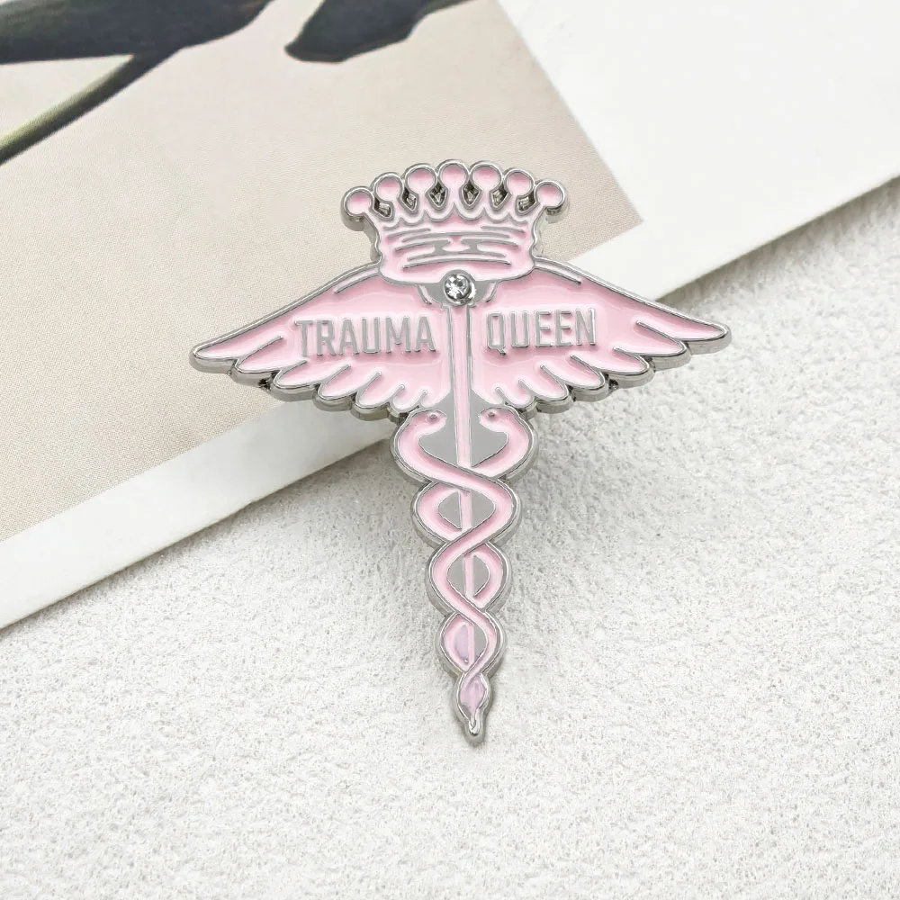 Trava Queen Enamel Pin Pink Caduceus Medical Brooch Crown Angel Wings Metal Badge Cute Fun Nurse Doctor Label Pin Jewelry Gift