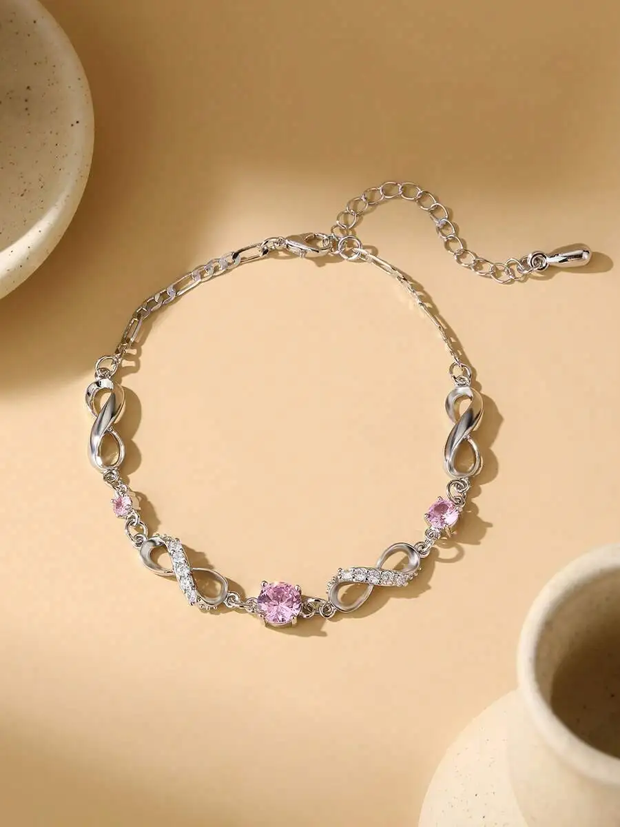 

Silver-Tone Infinity Motif Bracelet With Pink And Clear Rhinestone Embellishments And Extension Chain