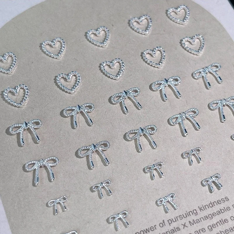 10 pièces alliage nœud papillon amour ongles Art breloques décorations 3D luxe métal argent arcs en forme de bijoux bricolage manucure conceptions fournitures