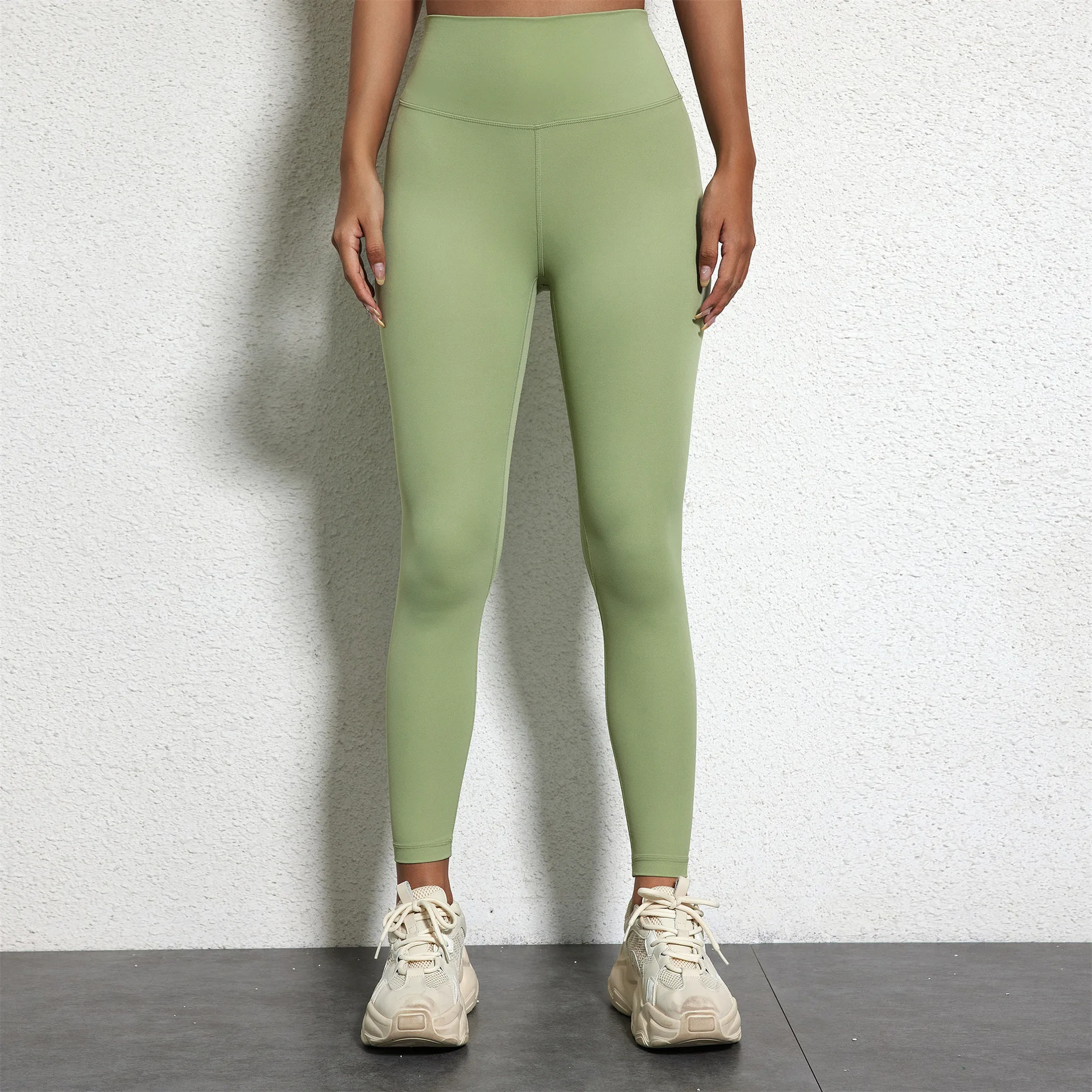 Crop Top Leggings sportivi pantaloni da Yoga da donna pantaloni da Fitness elasticizzati nudi da palestra pantaloni sportivi morbidi e comodi