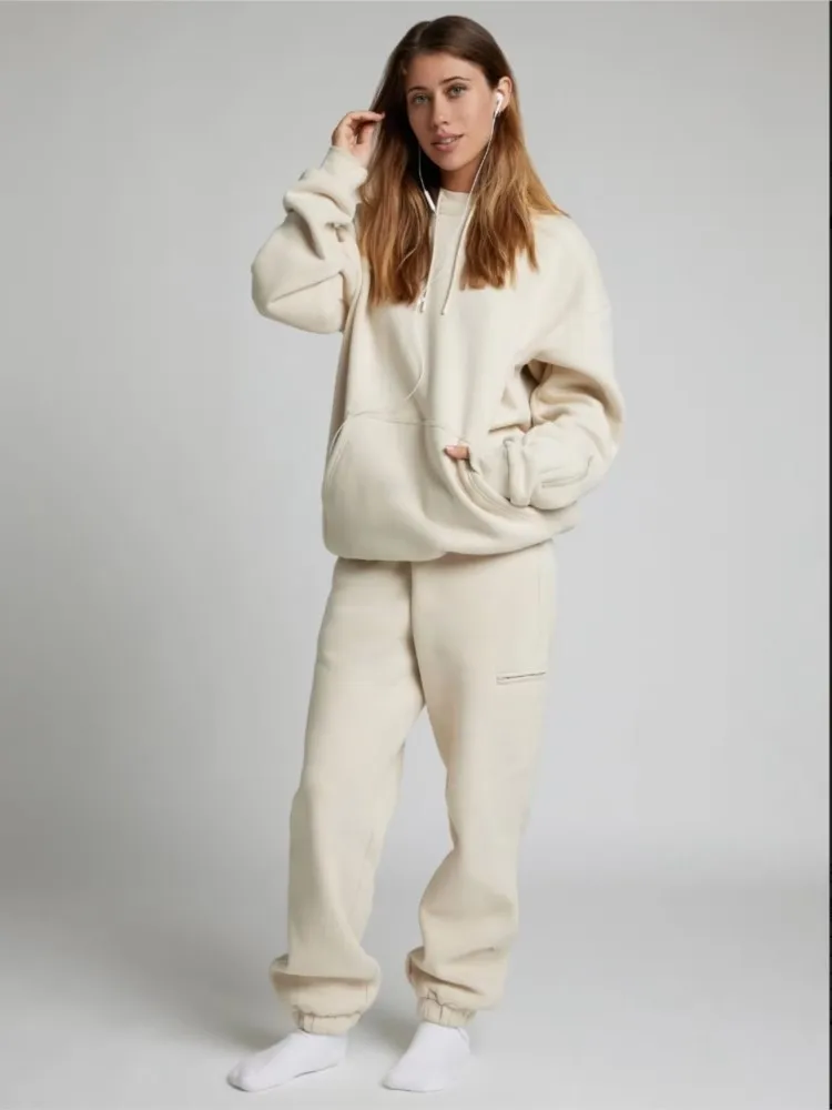 Set Dua Potong Longgar Saku Kasual Baru Musim Gugur Musim Dingin 2025 Set Celana Hoodie Sweter Lengan Panjang Warna Solid Wanita Pakaian Jalanan