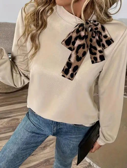 

2026 Autumn and Winter Elegant New Fashion Leopard Print Lace Up Round Neck Loose Casual Women's Pullover Top Female Clothing