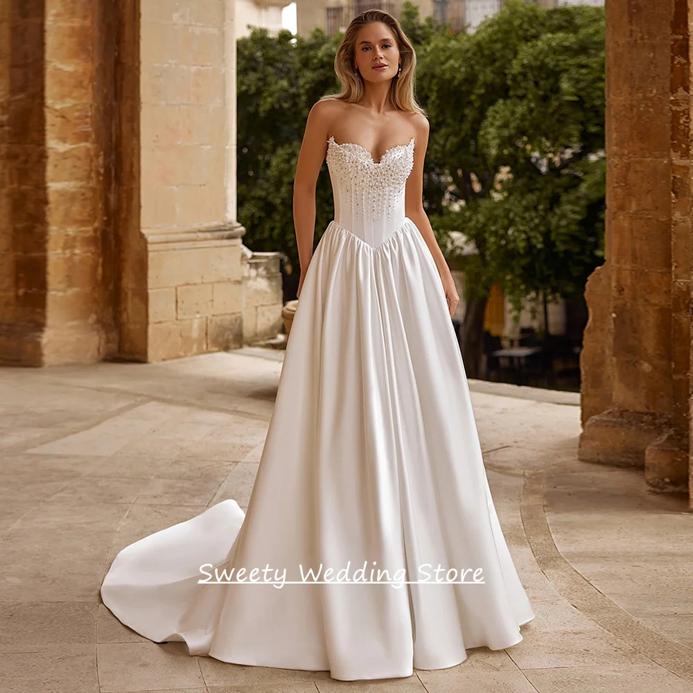 

New Wedding Dress Customized Sweetheart Sleeveless Beading Pearls Corset Bridal Gown Sweep Train Satin Bride Dresses