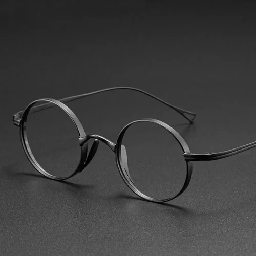 Imagen 2 del producto Gafas ultraligeras de titanio puro, gafas ópticas ovaladas Retro japonesas a la moda, montura graduada para miopía, gafas para hombre y mujer
