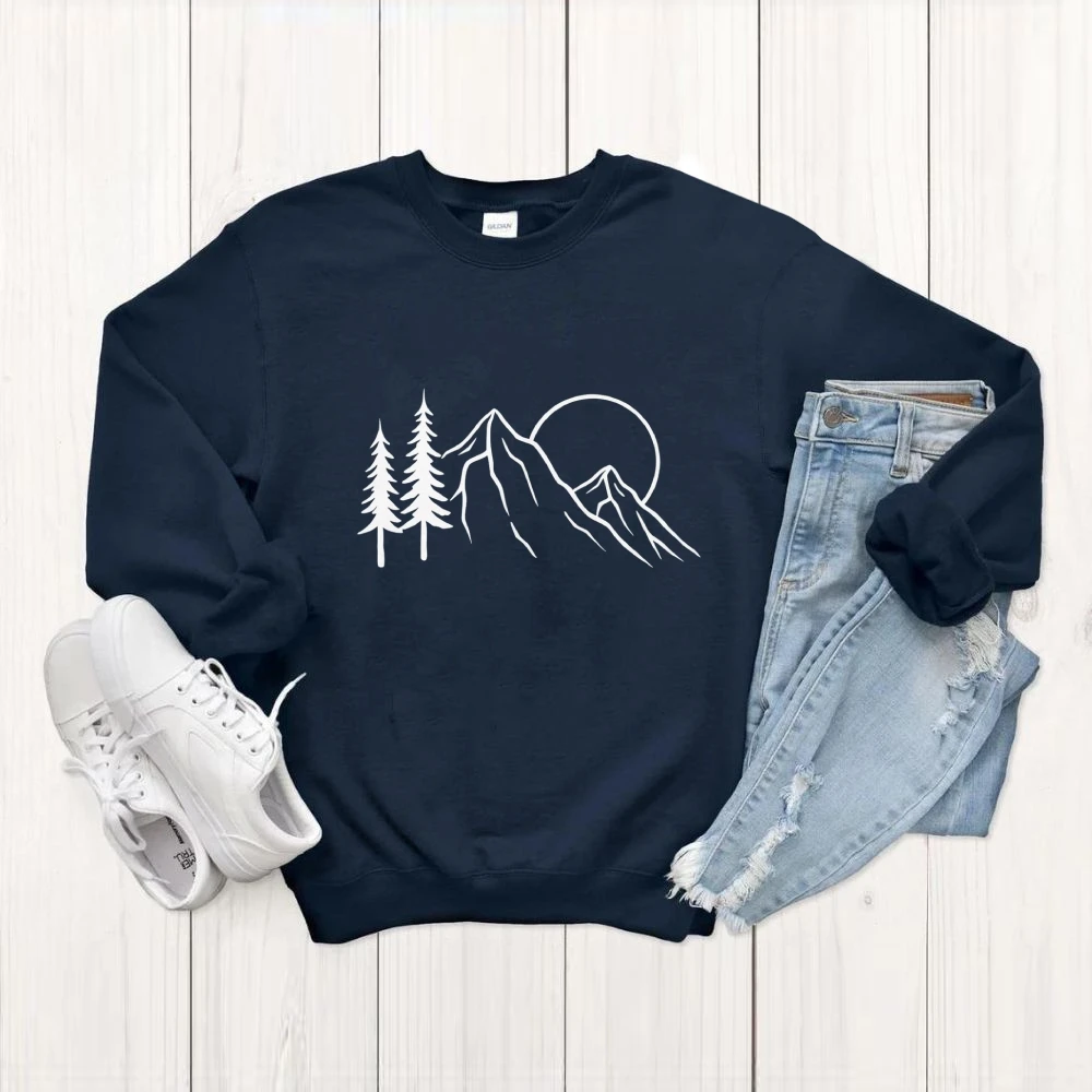 เสื้อสเวตเตอร์กราฟิกพระอาทิตย์ต้นไม้ภูเขาการออกแบบที่ได้รับแรงบันดาลใจจากธรรมชาติสไตล์ผจญภัยกลางแจ้งลำลองหลวมแขนยาวเสื้อที่สะดวกสบาย