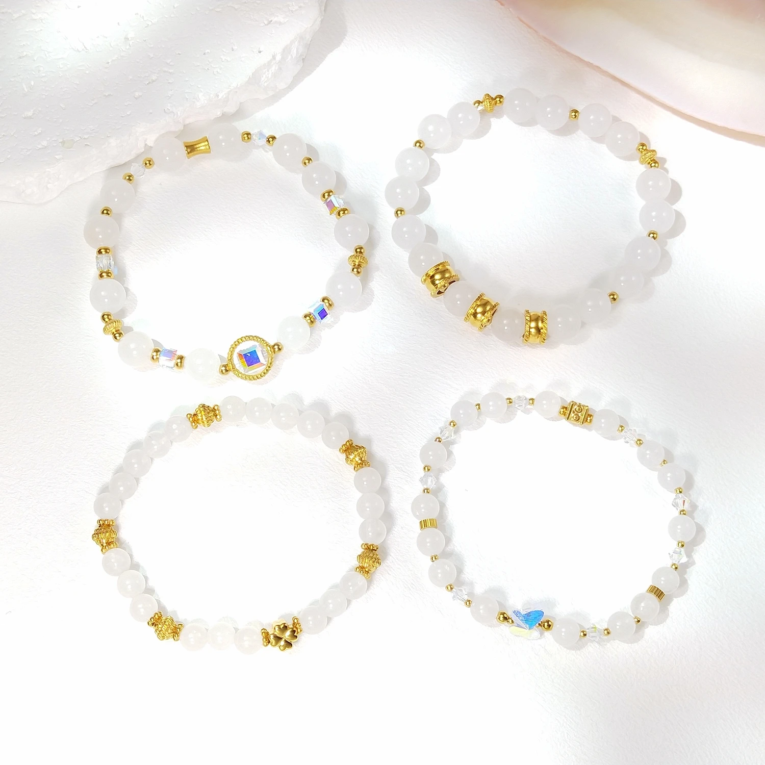 

Lii Ji Natural White Jade 6/8mm Gold Stainless Steel Elastic Bracelet