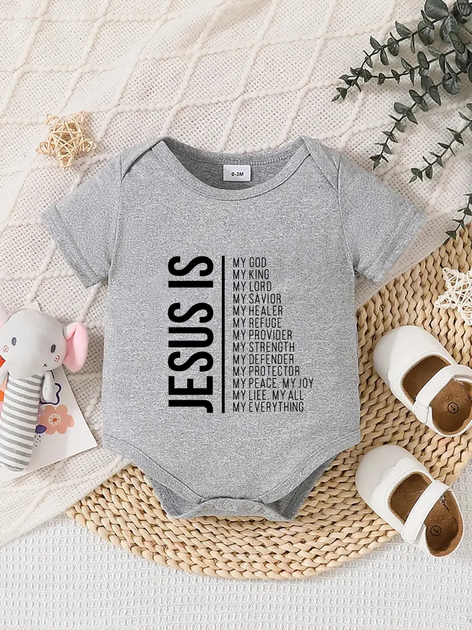 Playful letter-printed baby short-sleeve triangle bodysuit. Button closure for easy dressing, machine washable